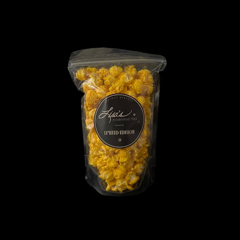 cheddar popcorn in bag with lisa's circle sticker with logo and limited edition