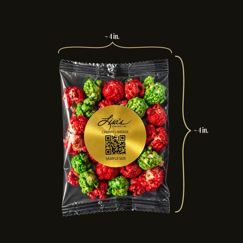 Packaged cherry limeade popcorn with a gold label on a black background