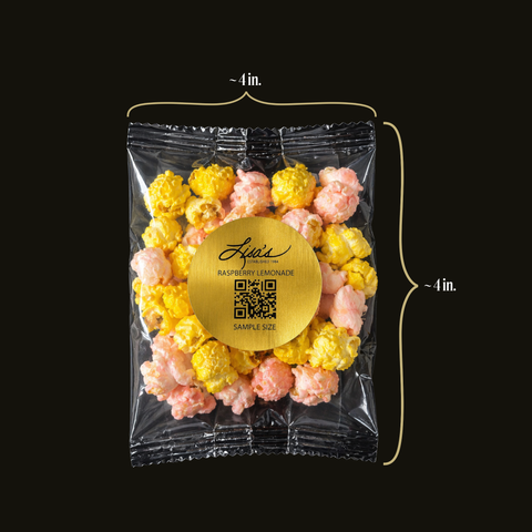 Packaged raspberry lemonade popcorn with a gold label on a black background